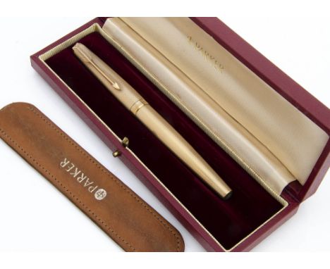 An early 1970s Parker 9ct gold Presidential Single fountain pen, 26g, engine turned barrel and cap, engraved initials, in red