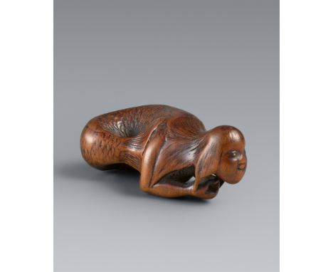 Netsuke eines Meerweibchens (ningyo). Buchsbaum. Frühes 19. Jh.Sign.: KorakusaiMit langem Fischkörper und umherschlagender Sc