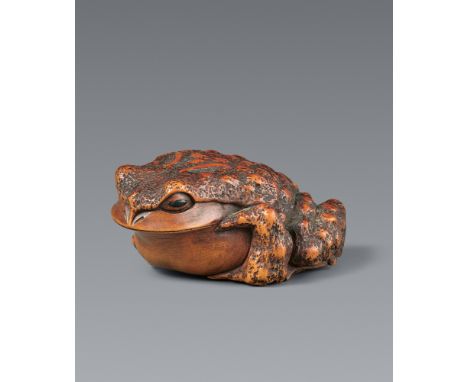 Netsuke einer hockenden Kröte. Buchsbaum. Ise. 19. Jh.Sign.: MasanaoIn geduckter Haltung auf die Vorderfüße aufgestützt, den 
