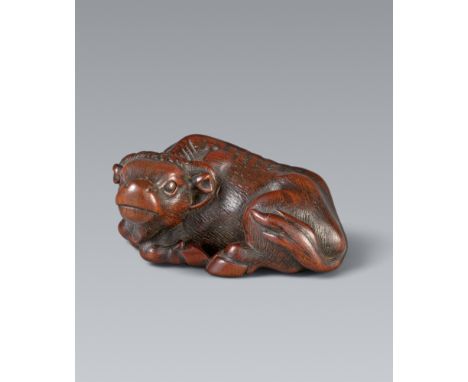 Netsuke eines liegenden Ochsens. Holz. Ise. 19. Jh.Sign.: MasanaoMit nach links gewandtem Kopf, ohne Nasenpflock und Leitseil