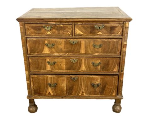 A Queen Anne figured walnut and possibly yew wood chest of drawers, early 18th century,   with a moulded and cross-banded ven