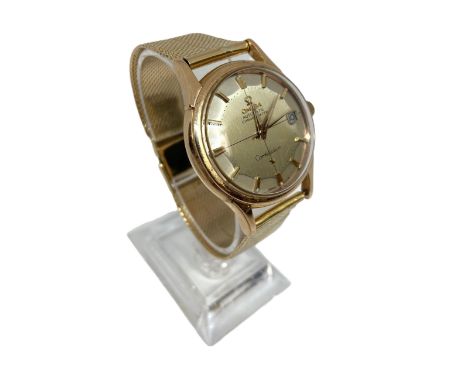 An Omega de Luxe Constellation Automatic 18 carat Gold Watch, circa 1965, designed by Gerald Genta,   with date aperture, Swi
