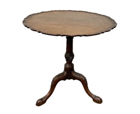 A George III mahogany wine table, circa 1780,  with a wide cusped circular top, with snap top hinge and set on a ring turned 