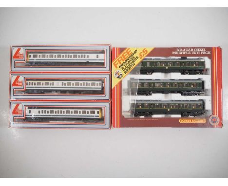 A HORNBY OO gauge R687 3-car class 110 DMU in BR green livery together with a LIMA 3-car class 117 DMU in white/blue livery -