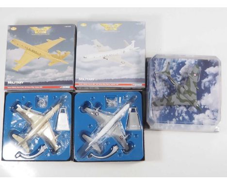 A group of three 1:144 scale Aviation Archive diecast airplanes by CORGI - comprising a pair of Hawker Siddely Nimrods togeth