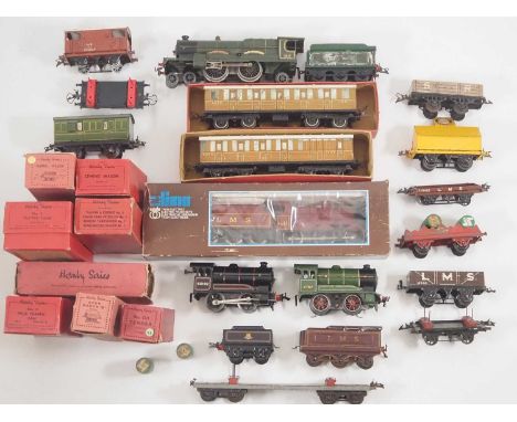 A large group of boxed and unboxed O gauge clockwork, 3-rail and 2-rail O gauge by HORNBY, LIMA and others to include a HORNB