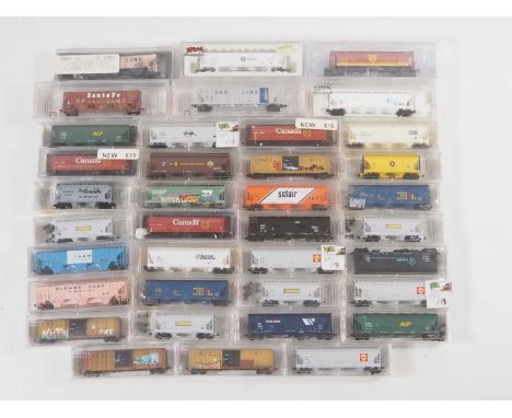 A group of American and Canadian Outline N gauge covered Hopper cars mostly by MICROTRAINS in various liveries - VG/E in VG b