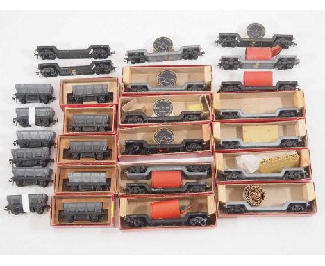 A large group of boxed and unboxed TRIX TWIN OO/HO gauge hopper and bogie well wagons, some with loads - G/VG in G boxes wher