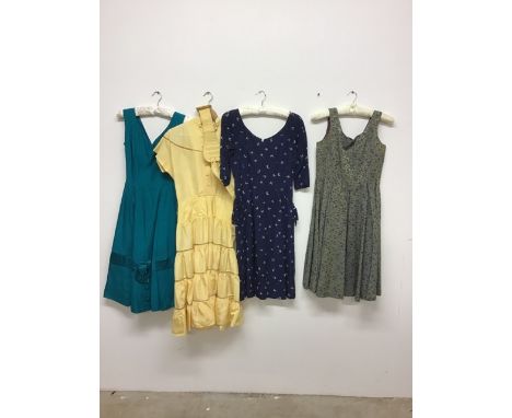 Four vintage dresses to include a 1950s novelty print swing dress with pockets by Susan Small, a 1950s couture taffeta tiered