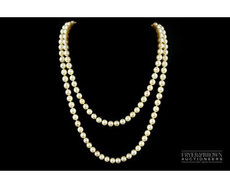 A fine quality vintage graduate two-row cultured pearl necklace, comprising 81:86 cultured pearls to an 18ct gold, diamond an