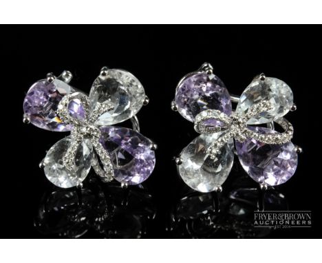 Kiki McDonough - a pair of diamond and pale amethyst 18ct white gold mounted quatrefoil ear clips, each set with four mixed c