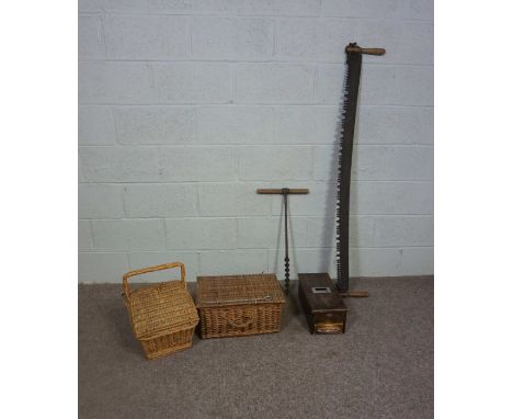 A fishing basket and another basket, with a small portable till, a two ended crosscut saw, a hand auger, and a bugle (6)
