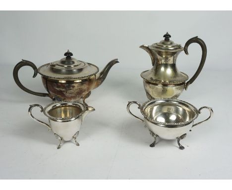 A Late Victorian Silver Plate Four Piece Tea Service, of semi ovoid form with gadrooned borders on shell and hoof feet, compr