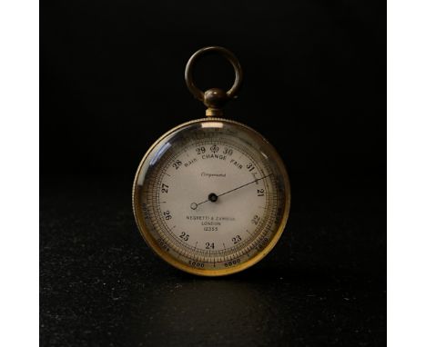 An early 20th century Negretti &amp; Zambra compensated pocket barometer model 12353 with a brass surround in a fitted case. 