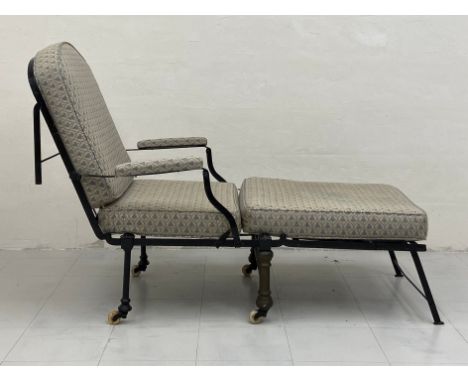A Victorian metamorphic campaign daybed having a folding wrought iron frame with loose reupholstered cushions and armrests ra