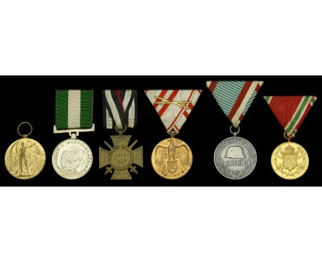 An unattributed Great War ‘Axis Powers’ group of four Germany, Cross of Honour 1914-18, combatant’s issue with swords, bronze