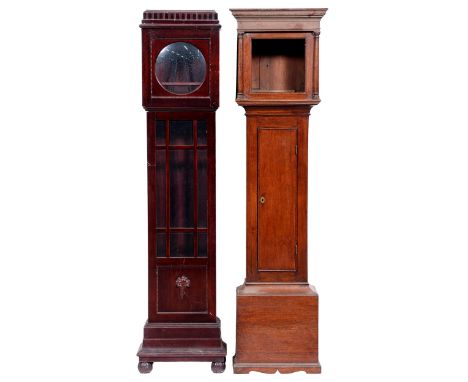 A George III oak longcase clockcase, with ogee moulded flat topped hood, pilasters flanking the door, the trunk enclosed by f