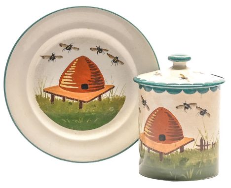 A Wemyss ware honey pot, cover and plate, Bovey Tracey period, painted by Joe Nekola with a bee skep and bees, pot and cover 