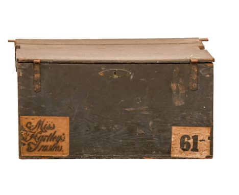 An English oak travelling coach trunk, early 19th c, with iron brackets and lock, black painted, printed pink paper trade lab