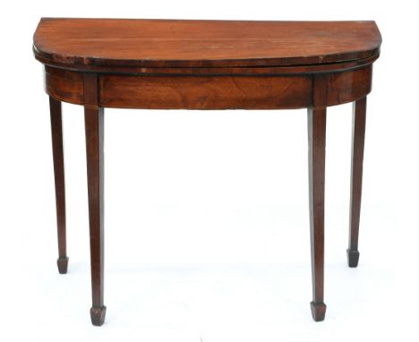 A George III mahogany card table, with fold over 'D' shaped top on square tapered legs, spade feet, 72cm h; 44 x 91.5cm  Faul