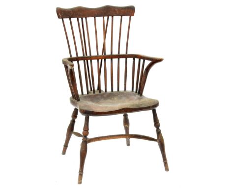 An ash comb back Windsor armchair, Thames Valley or Lincolnshire, first half 19th c, with spindle back, incurved arm supports