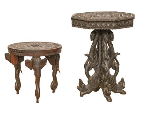 An Anglo-Indian ebonised and carved 'Bombay blackwood' table, late 19th c, the octagonal top on quadruple grotesque legs, 61c