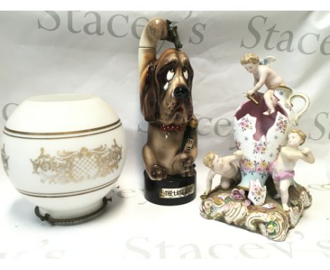 A glass lamp shade, Bond Ware blood hound vintage last shot porcelain whiskey container/ music box and a Dresden broken vase 