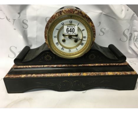An antique Victorian marble mantle clock. A slate mantle clock with Roman numeral face. 45 cm by 30cm approximately.