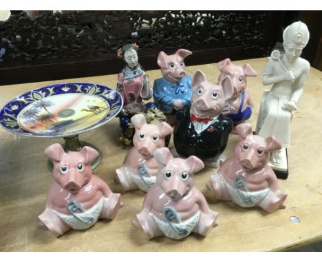 A Collection of NatWest Wade porcelain piggy banks, a Noritake porcelain cake stand, a Chinese porcelain figure etc