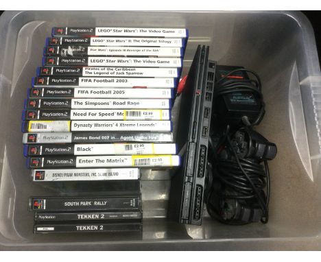 A slimline PS2 Playstation console, games and accessories.