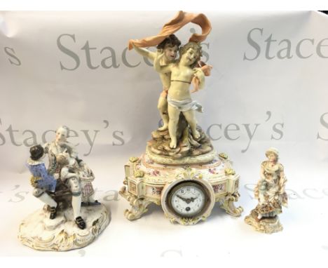 A Collection of German classical style porcelain figures including a porcelain mantle clock with a mounted figure group