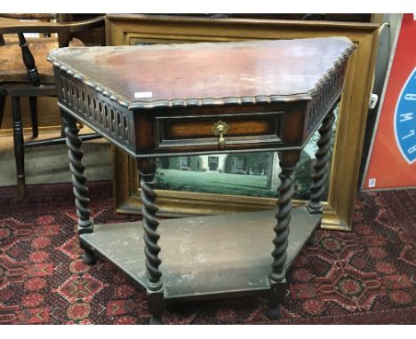 An oak side table with a shaped edge above a single drawer on barley twist legs united by an under shelf 85cm. NO RESERVE