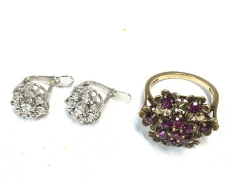 A pair of 9ct white gold illusion set diamond set clip earrings and a 9 carat gold ruby floral design ring. Total jewellery w