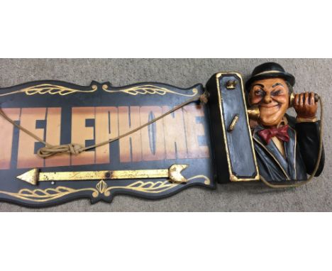 A Laurel and Hardy telephone sign with a gold coloured arrow that is adjustable/able to rotate. It measures around 106cm wide
