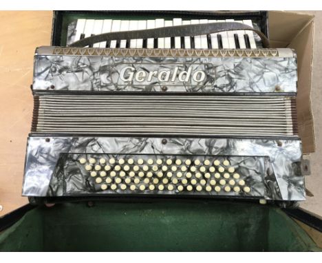 A vintage cased Geraldo accordion.