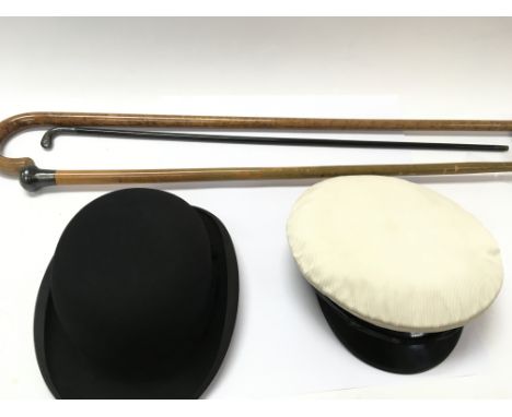 Silver topped walking sticks a bowler hat Chinese silk jackets etc. Postage D. NO RESERVE
