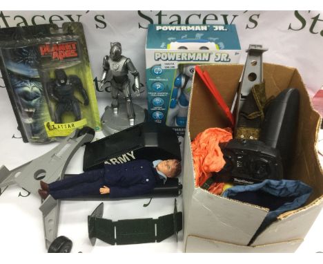 A box of toys and models comprising Action Man outfits, a remote control Helicopter and other items.
