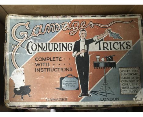 A collection of antique toys and games including Gamages Conjuring Tricks, a battery operated Patrol Phone, a sma,, RMS Titan