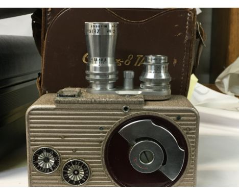A collection of vintage cameras and equipment included. Includes a Cinemax 8 TA, a black Minolta camera with all equipment in