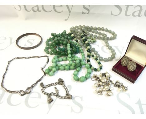 A Collection of jewellery including silver simulated pearl earrings, silver charm bracelet, silver small necklace, silver ban