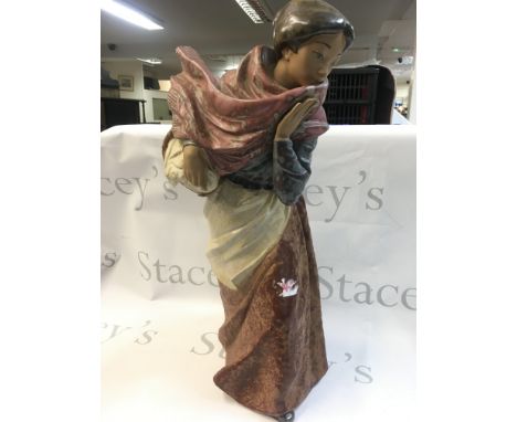 A porcelain Nao figure, country woman with basket and scarf. 48cm This lot cannot be posted