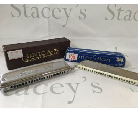 Meridian stage pro harmonica, and a Tombo Unica De Luxe formal harmonica