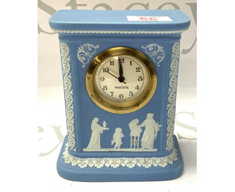 A Wedgewood porcelain mantle clock. 16cm.