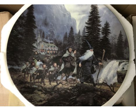 A collection of antique Wedgwood plates, including some plates from Lord of the Rings,