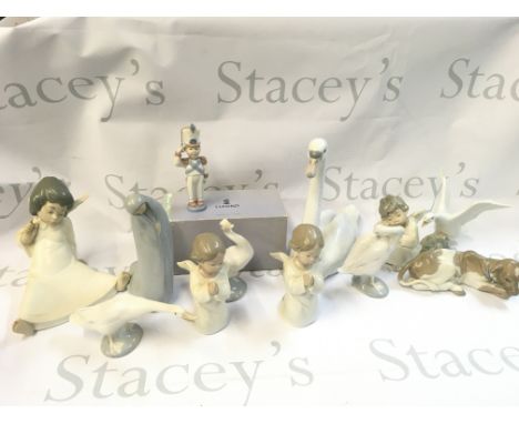 A Collection of porcelain Lladro figures including Toy Solider Christmas ornament, angel children, swans and geese
