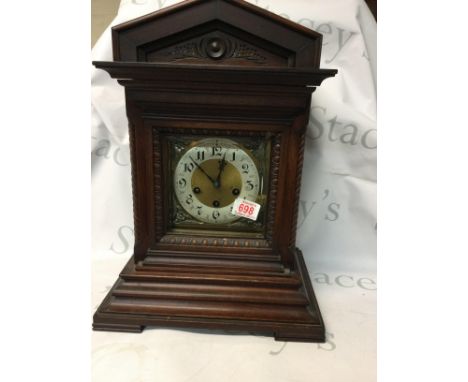 A Walnut cased early 20th century mantel clock. Height 46cm