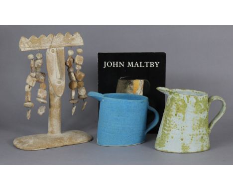 A John Maltby ceramic sculpture with strings of pendants either side of a central crowned head, 12¼” high x 9” wide (repaired