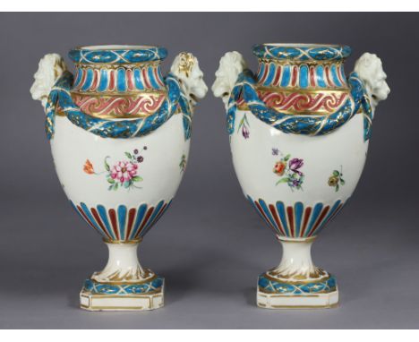 A pair of late 18th century Chelsea/Derby porcelain ovoid neo-classical vases, the shoulders moulded with lion masks, husk sw