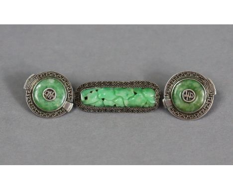 A pair of Chinese carved green jade &amp; silver-mounted circular ear-clips; &amp; a Chinese carved &amp; pierced green jade 