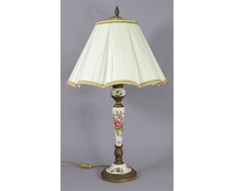 A porcelain &amp; gilt-metal table lamp on slender tapering column &amp; round pedestal foot, painted decoration of flowers &